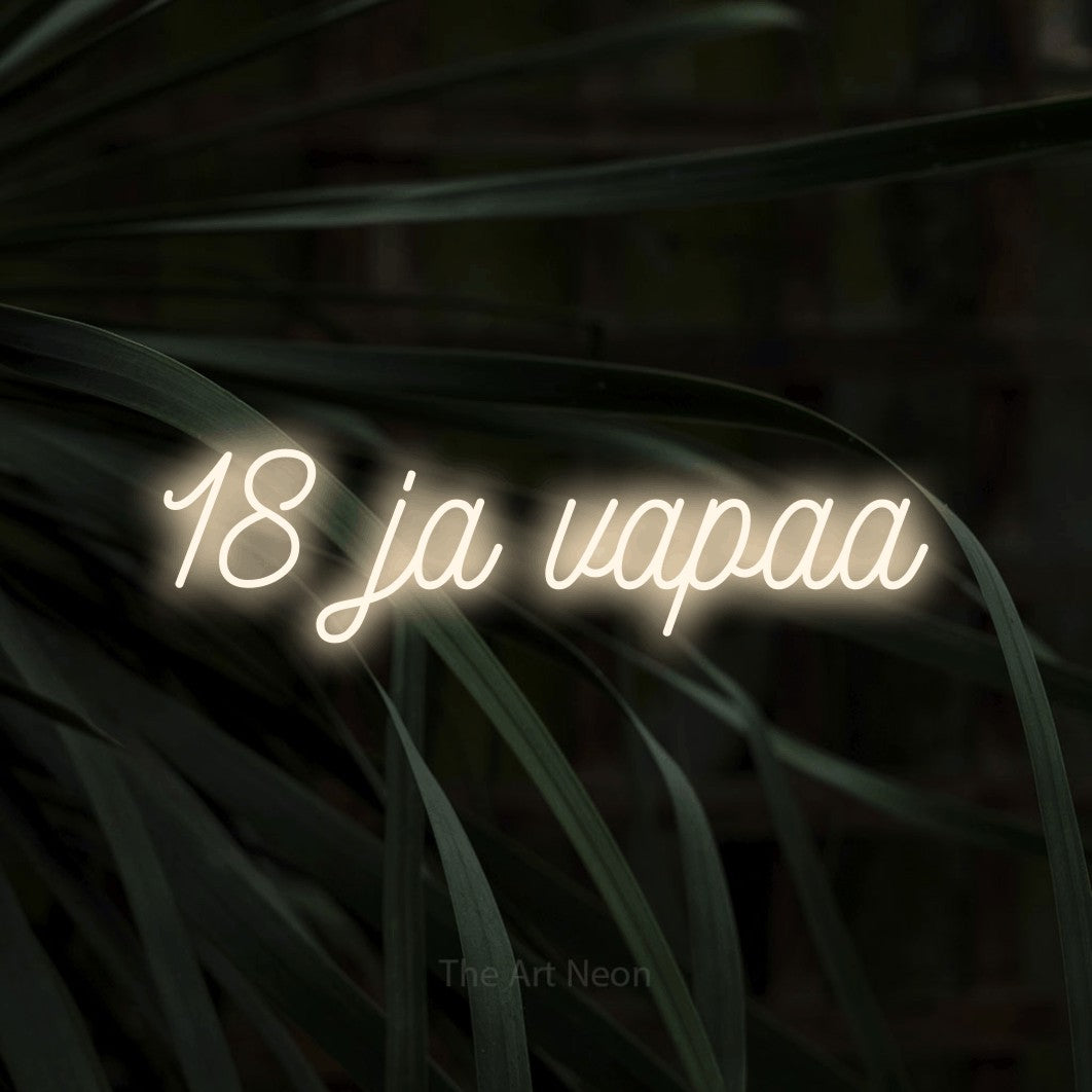 LED neon sign reading “18 ja vapaa”, arranged in a single line.