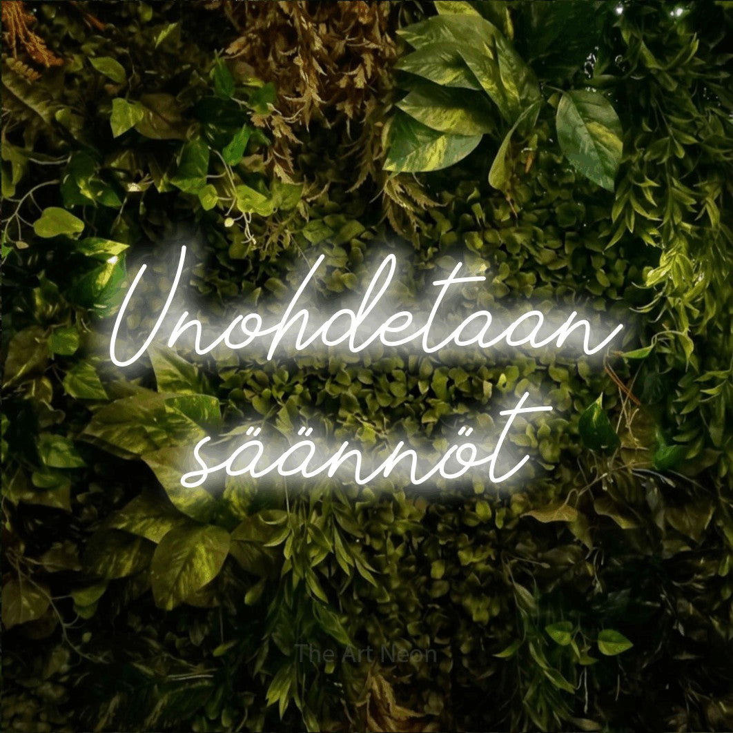 LED neon sign reading “Unohdetaan säännöt”, arranged in 2 lines.