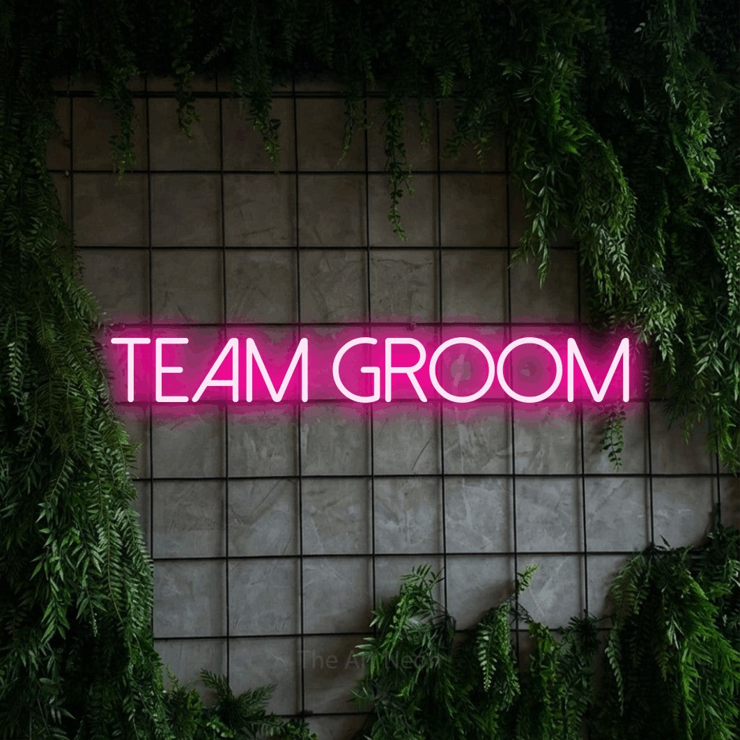LED neon sign reading “Team groom”, arranged in a single line.