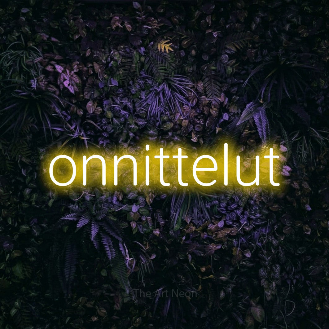 LED neon sign reading “onnittelut”, arranged in a single line.