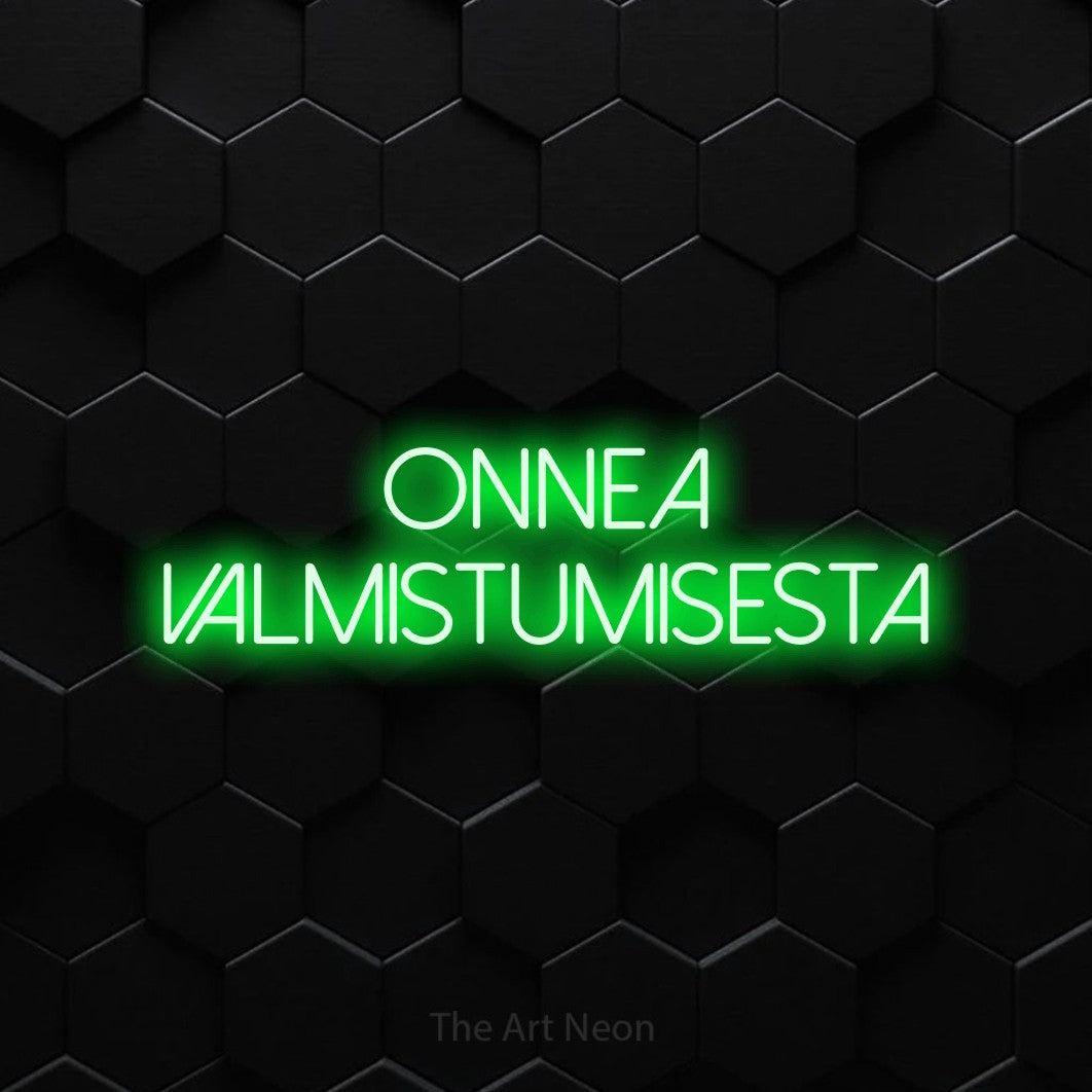 LED neon sign reading “onnea valmistumisesta”, arranged in 2 lines.