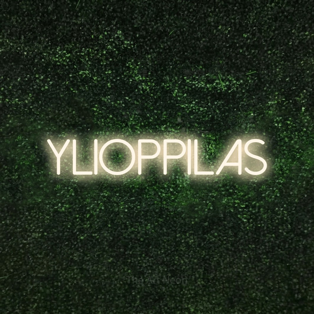 LED neon sign reading “YLIOPPILAS”, arranged in a single line.