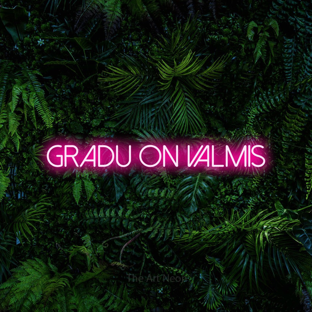 LED neon sign reading “Gradu on valmis”, arranged in a single line.