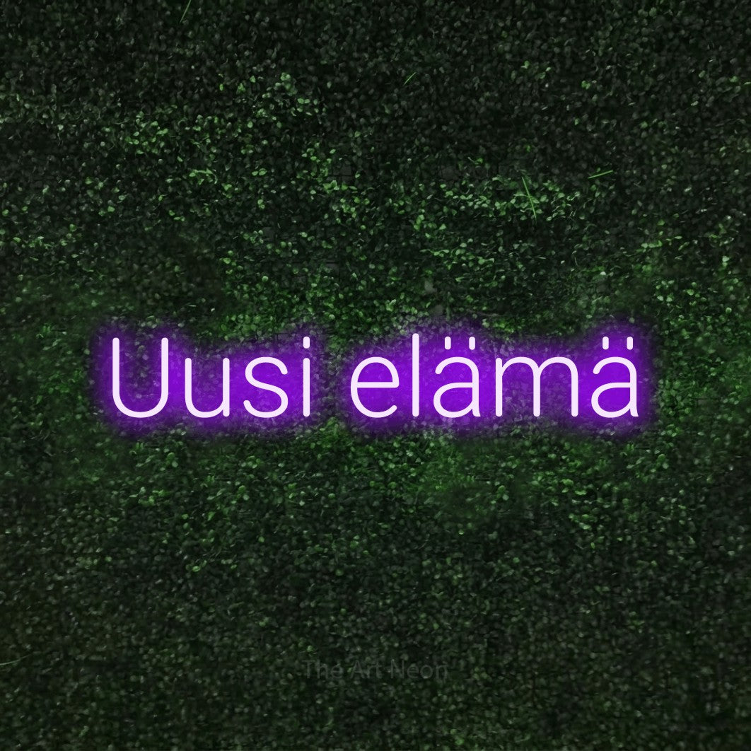 LED neon sign reading “Uusi elämä”, arranged in a single line.