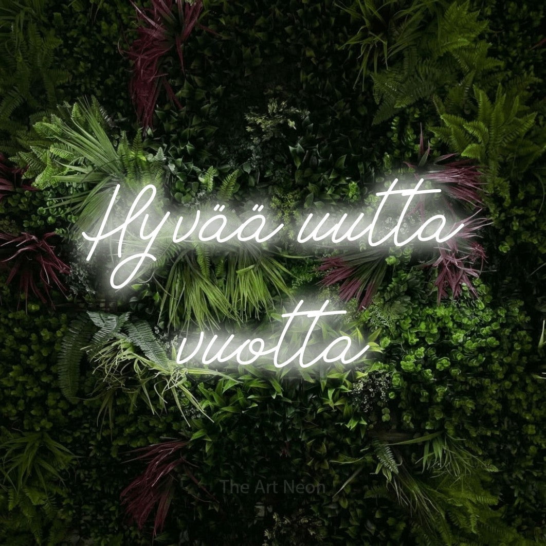 LED neon sign reading “Hyvää uutta vuotta”, arranged in 2 lines.