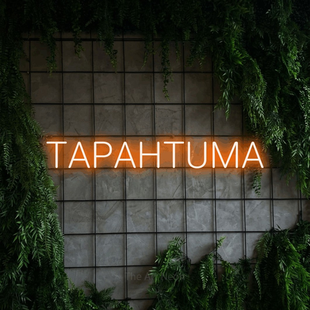 LED neon sign reading “TAPAHTUMA”, arranged in a single line.