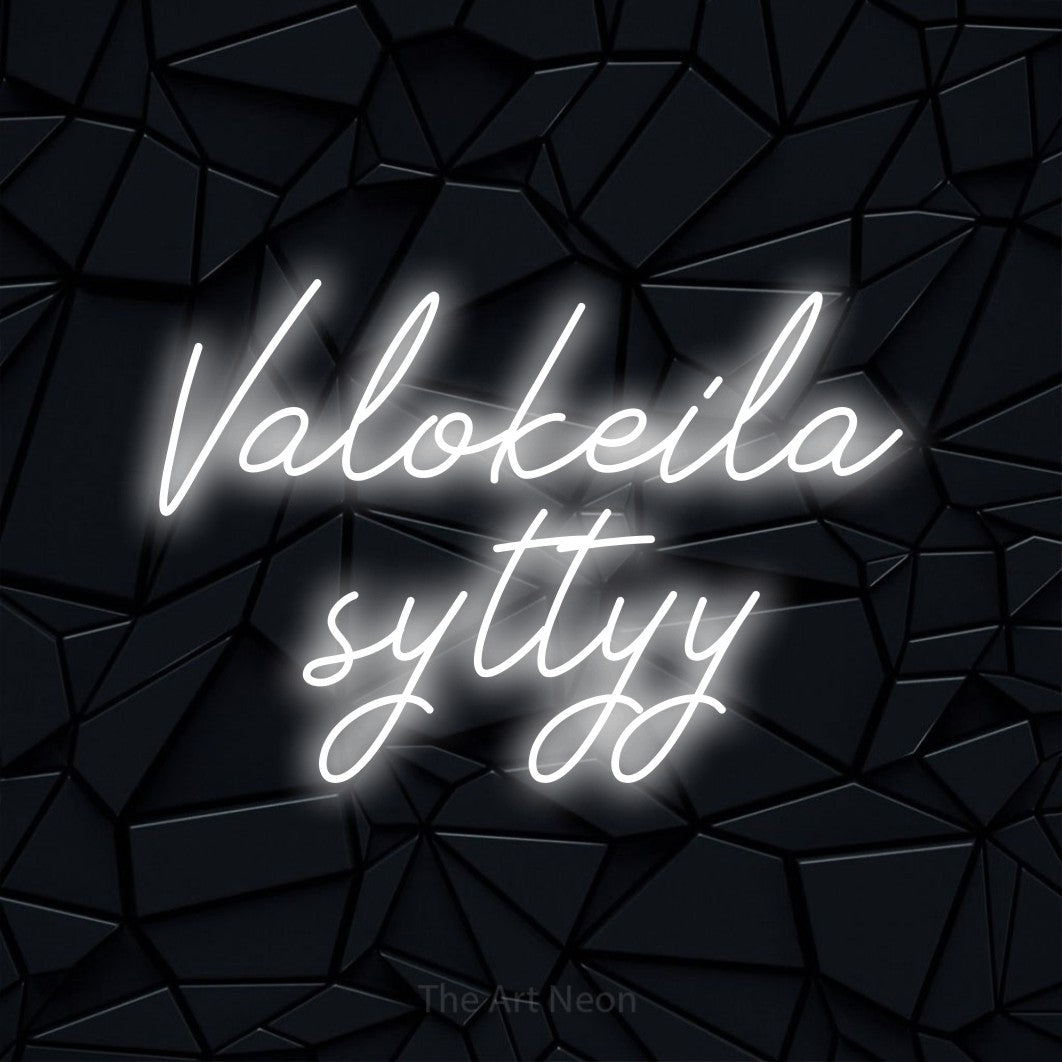 LED neon sign reading “Valokeila syttyy”, arranged in 2 lines.
