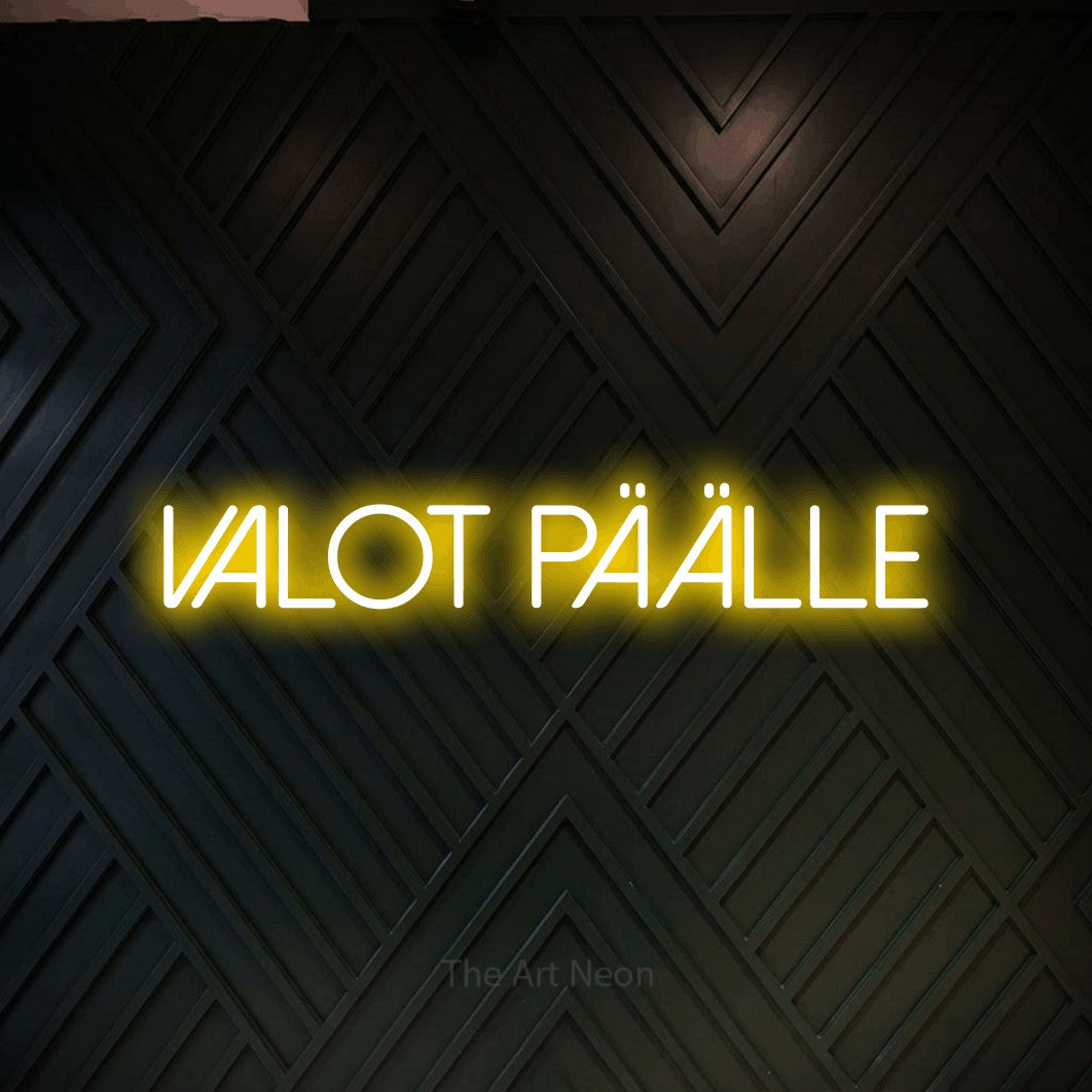 LED neon sign reading “Valot päälle”, arranged in a single line.