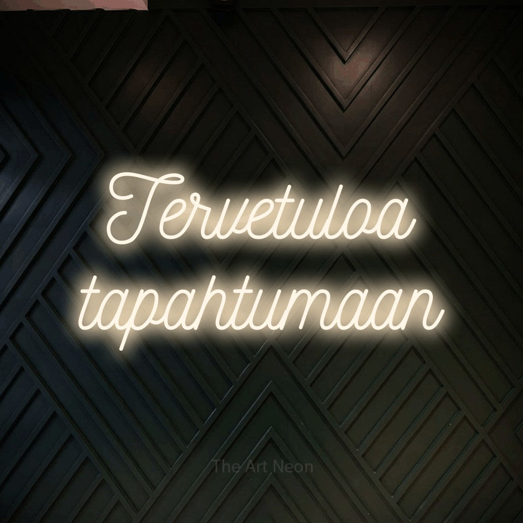 LED neon sign reading “Tervetuloa tapahtumaan”, arranged in 2 lines.