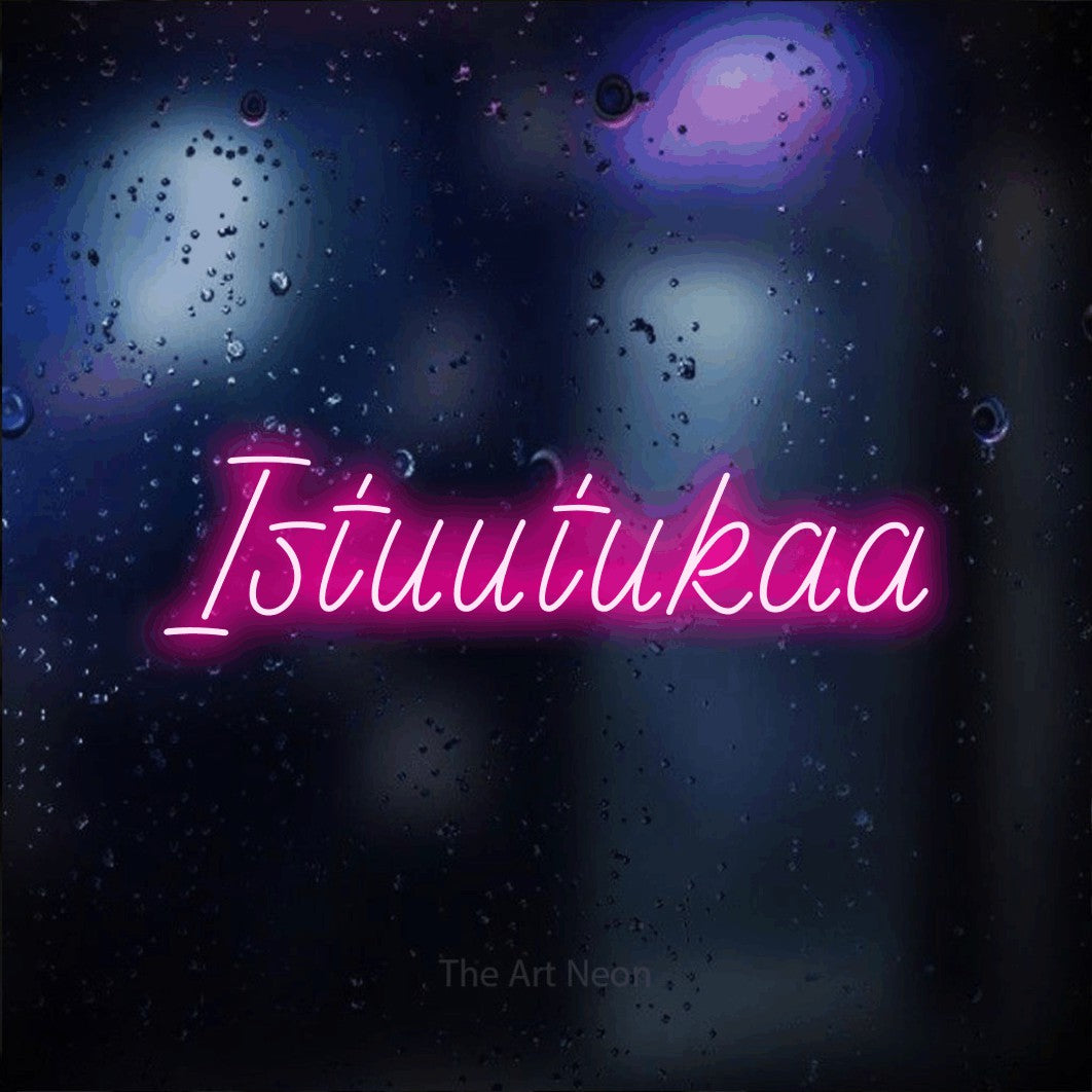 LED neon sign reading “Istuutukaa”, arranged in a single line.