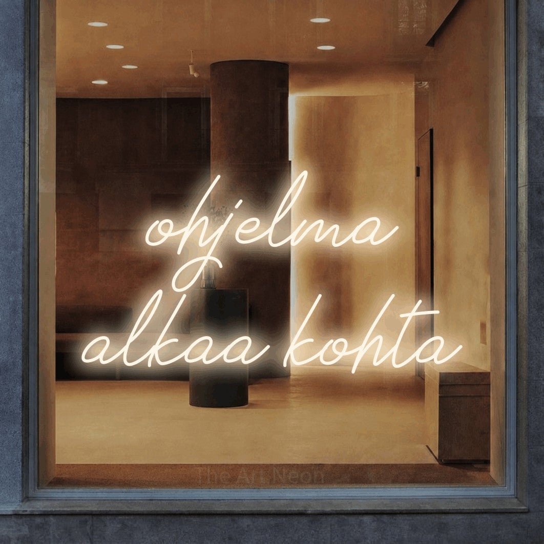 LED neon sign reading “ohjelma alkaa kohta”, arranged in 2 lines.