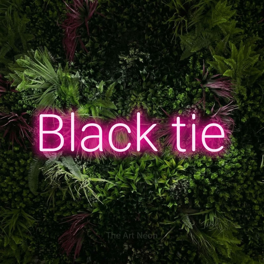 LED neon sign reading “Black tie”, arranged in a single line.