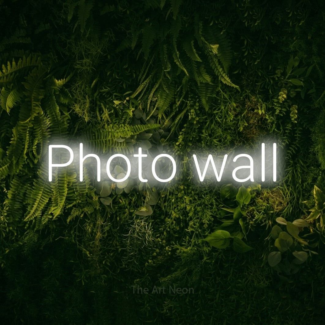LED neon sign reading “Photo wall”, arranged in a single line.
