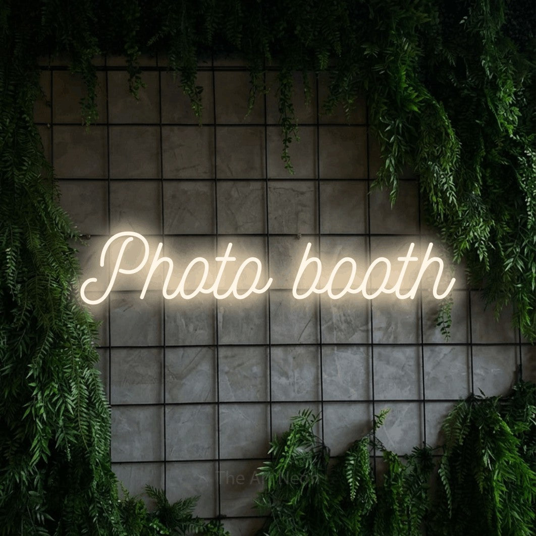 LED neon sign reading “Photo booth”, arranged in a single line.