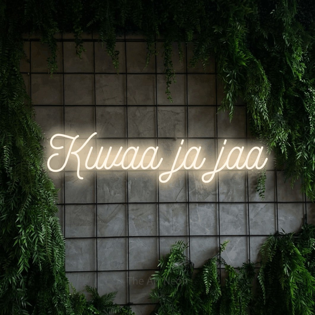 LED neon sign reading “Kuvaa ja jaa”, arranged in a single line.