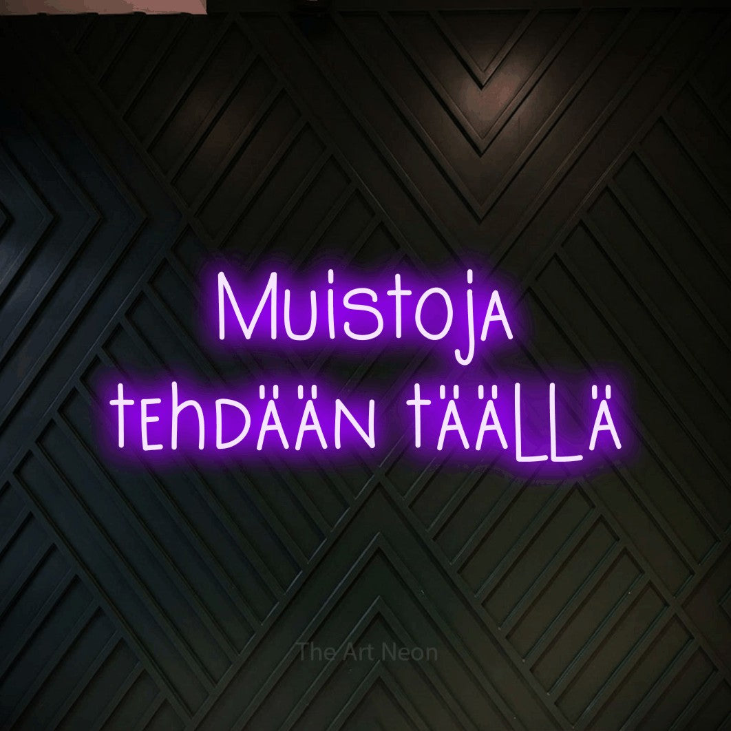 LED neon sign reading “Muistoja tehdään täällä”, arranged in 2 lines.