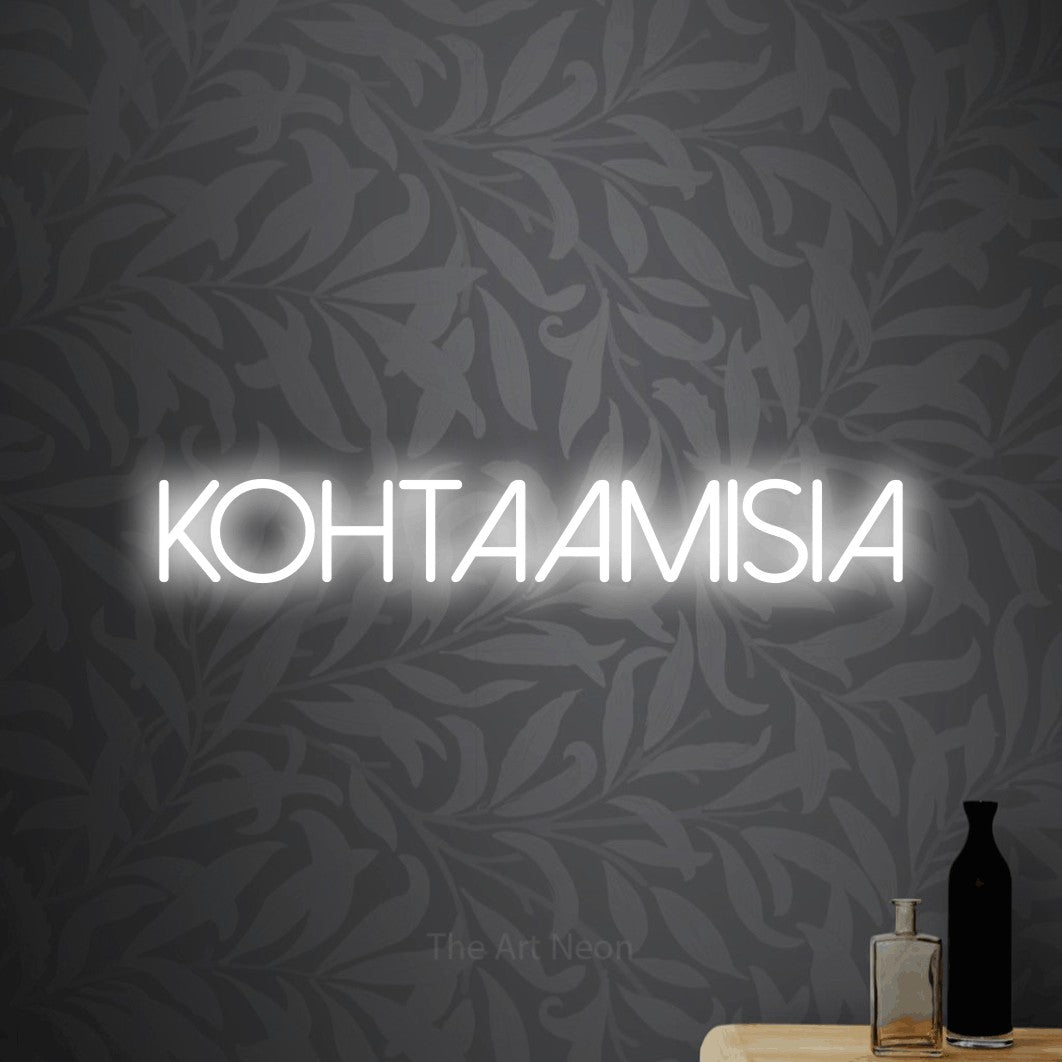 LED neon sign reading “KOHTAAMISIA”, arranged in a single line.