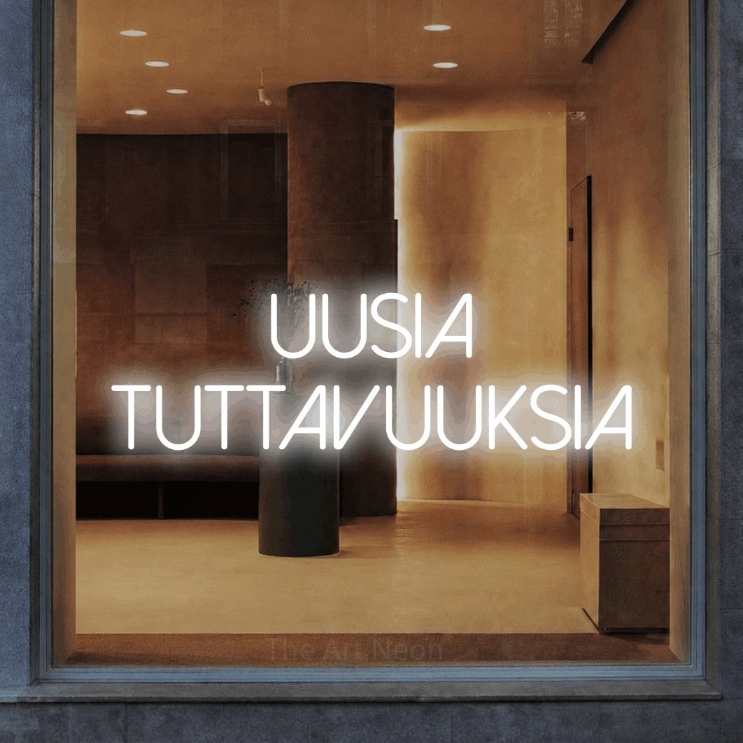 LED neon sign reading “uusia tuttavuuksia”, arranged in 2 lines.