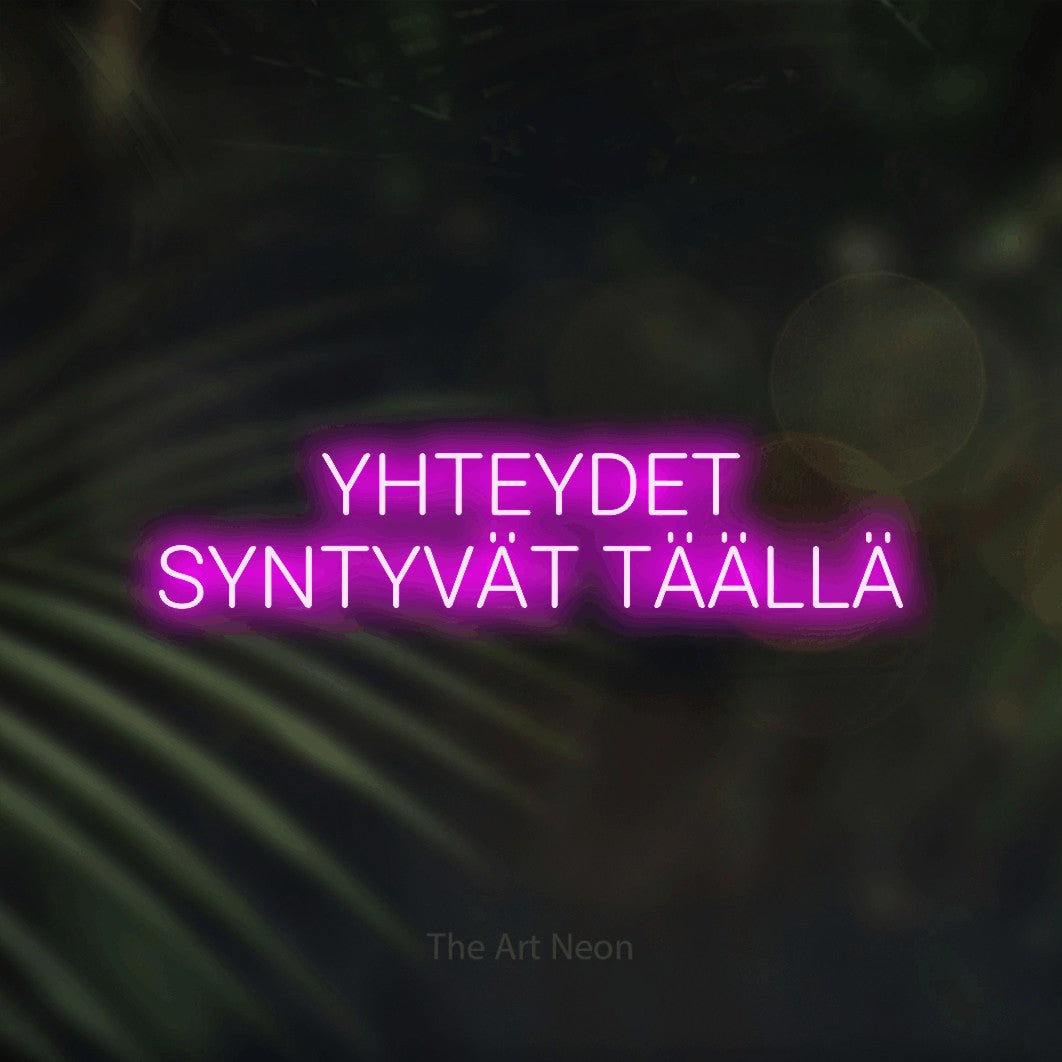 LED neon sign reading “YHTEYDET SYNTYVÄT TÄÄLLÄ”, arranged in 2 lines.