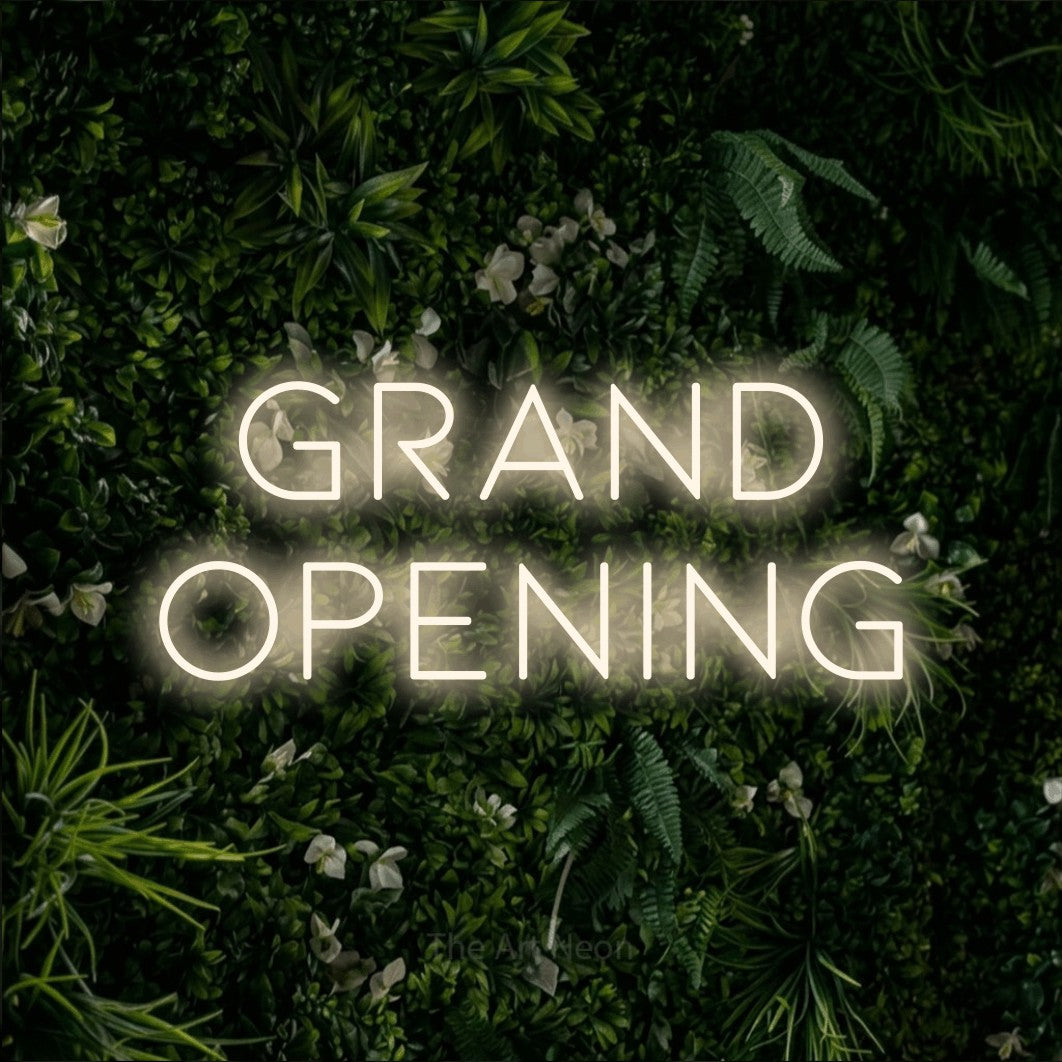 LED neon sign reading “Grand opening”, arranged in 2 lines.
