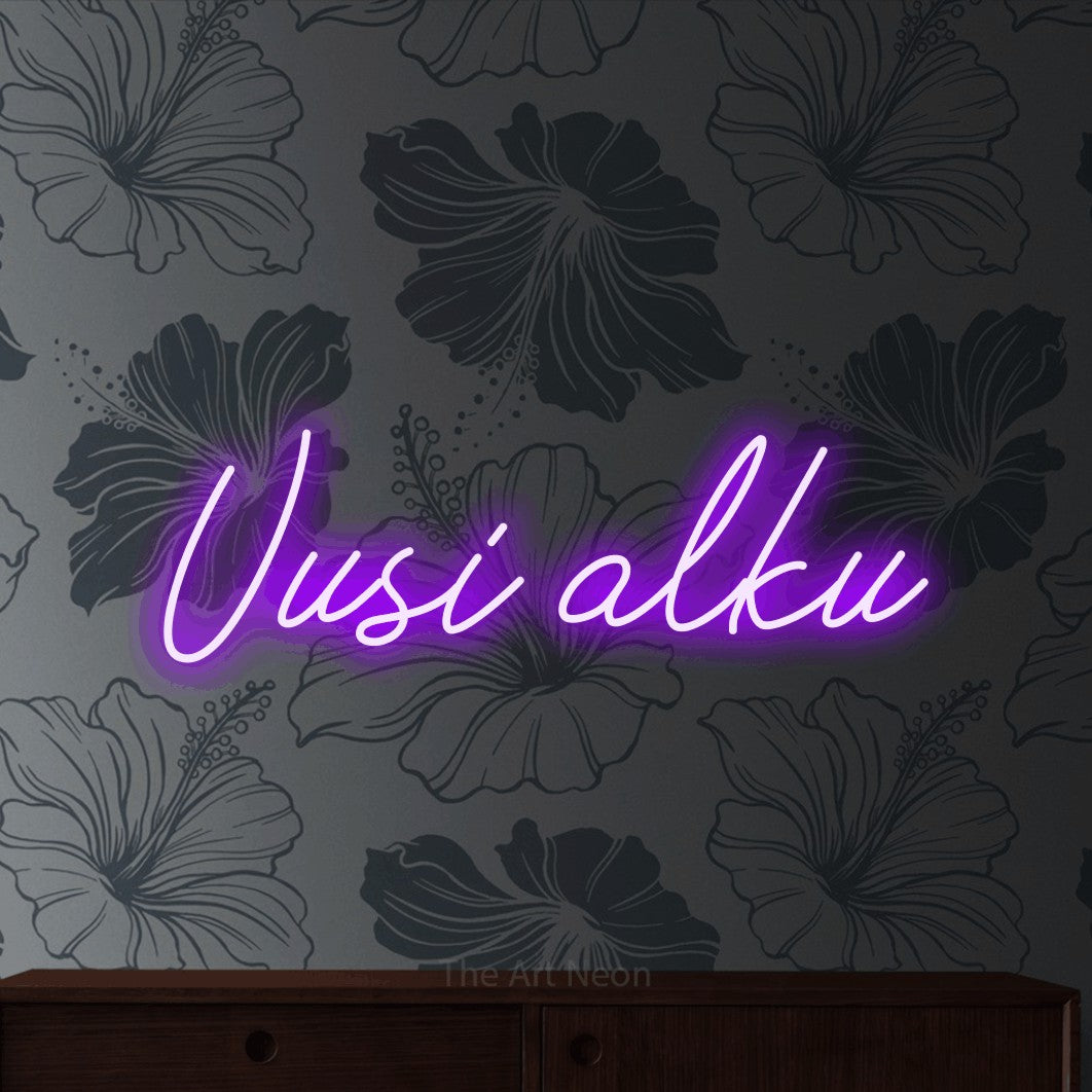 LED neon sign reading “Uusi alku”, arranged in a single line.