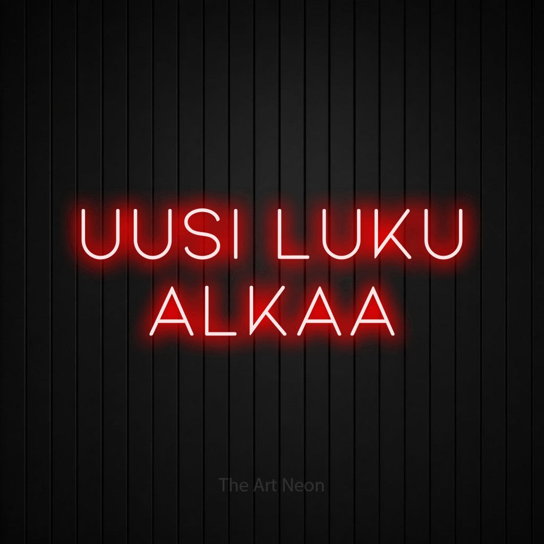 LED neon sign reading “UUSI LUKU ALKAA”, arranged in 2 lines.