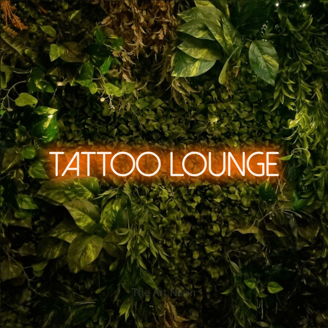 LED neon sign reading “Tattoo lounge”, arranged in a single line.