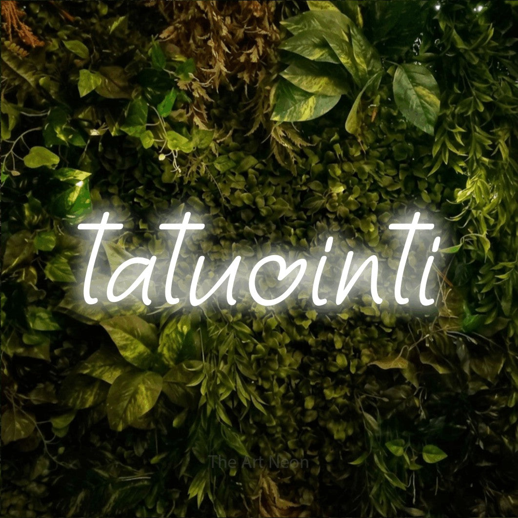 LED neon sign reading “tatuointi”, arranged in a single line.