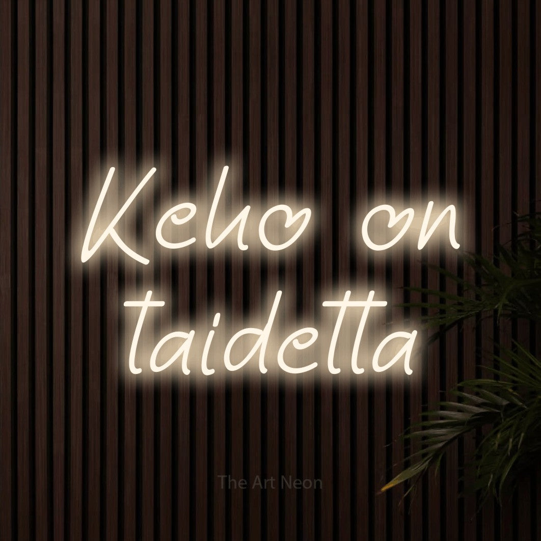 LED neon sign reading “Keho on taidetta”, arranged in 2 lines.