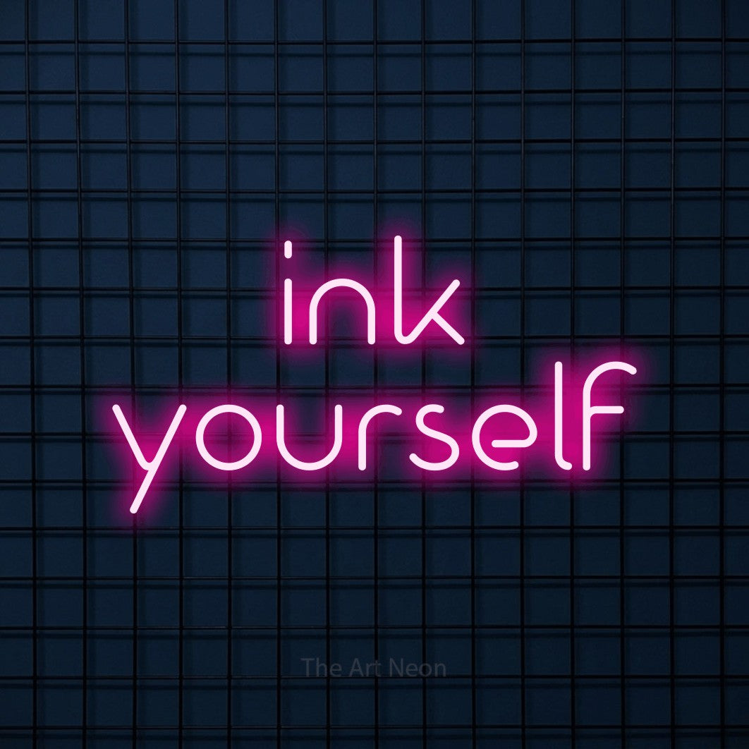 LED neon sign reading “ink yourself”, arranged in 2 lines.