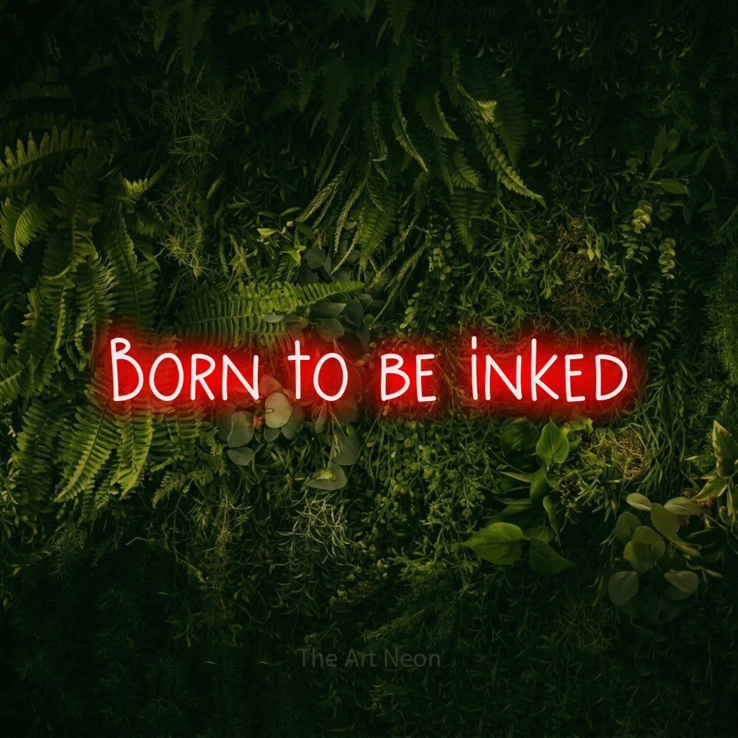 LED neon sign reading “Born to be inked”, arranged in a single line.