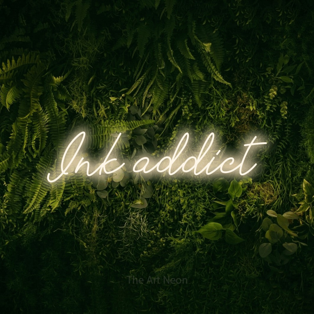 LED neon sign reading “Ink addict”, arranged in a single line.
