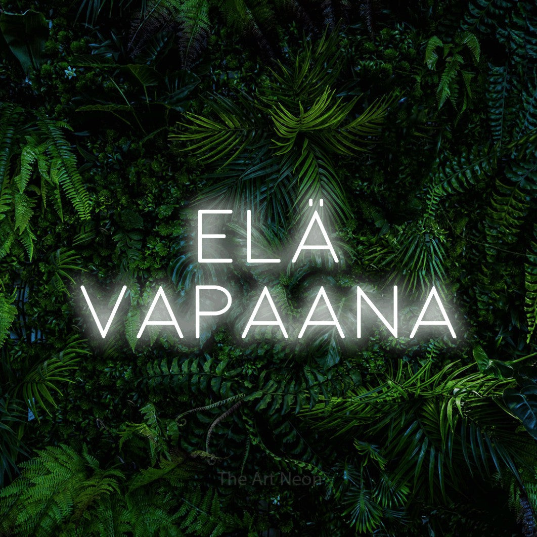 LED neon sign reading “elä VAPAANA”, arranged in 2 lines.