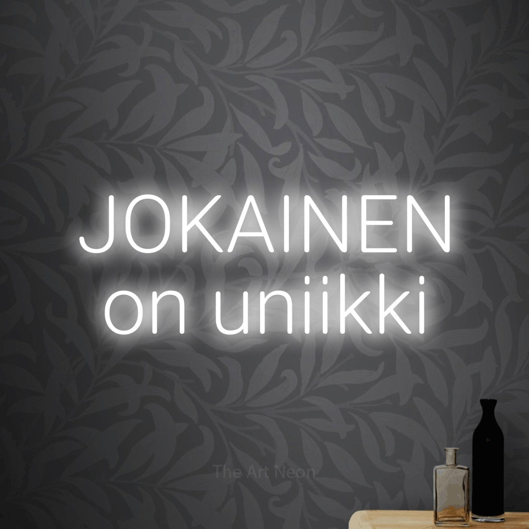 LED neon sign reading “JOKAINEN on uniikki”, arranged in 2 lines.