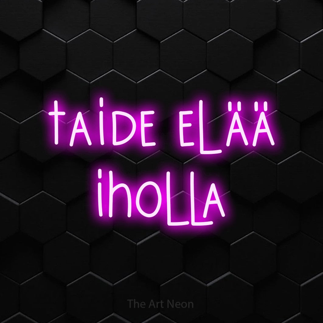 LED neon sign reading “taide elää iholla”, arranged in 2 lines.