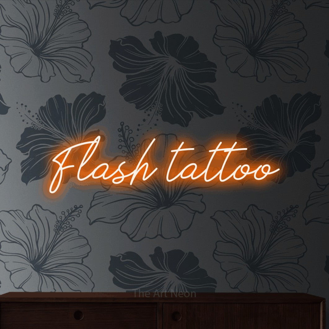 LED neon sign reading “Flash tattoo”, arranged in a single line.