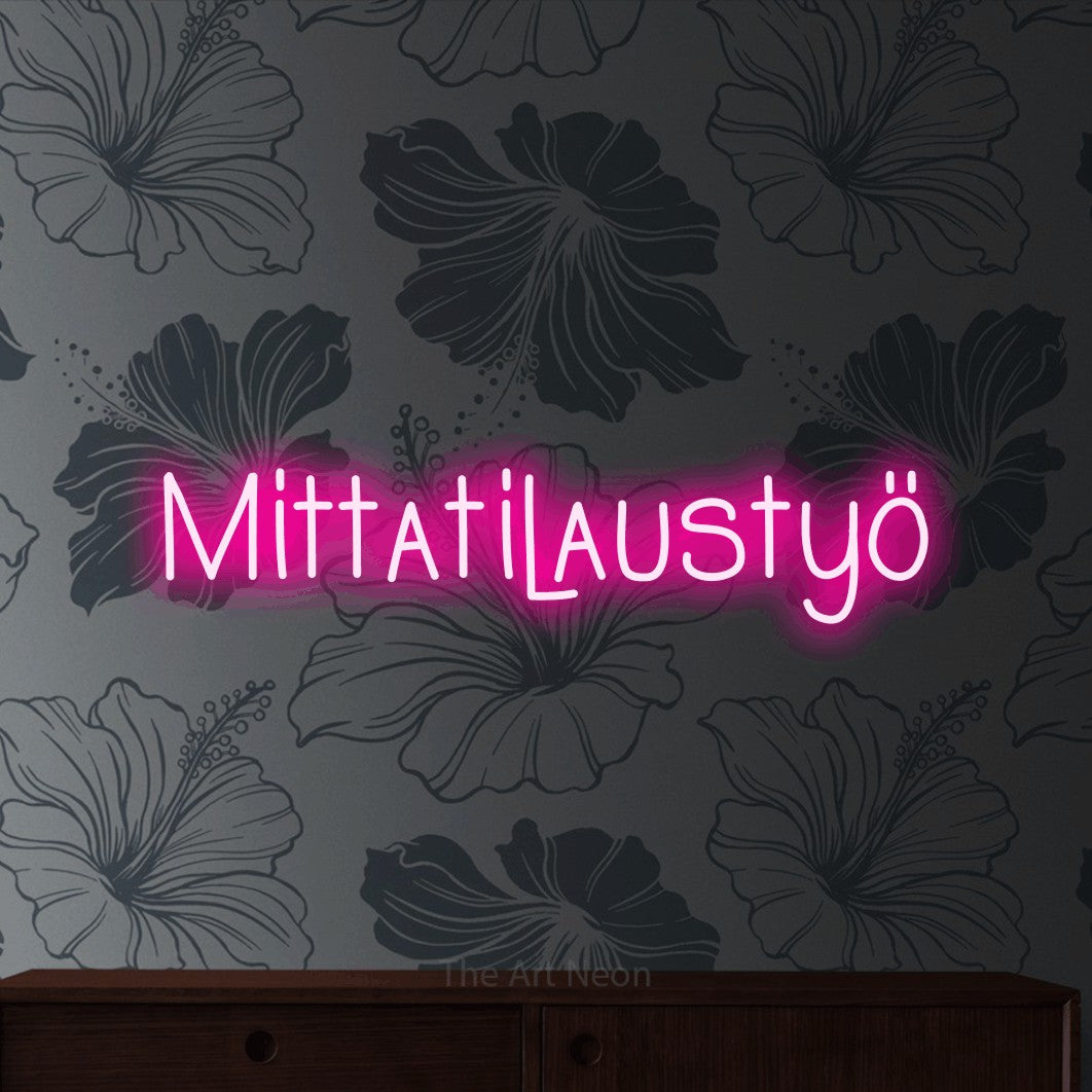 LED neon sign reading “Mittatilaustyö”, arranged in a single line.