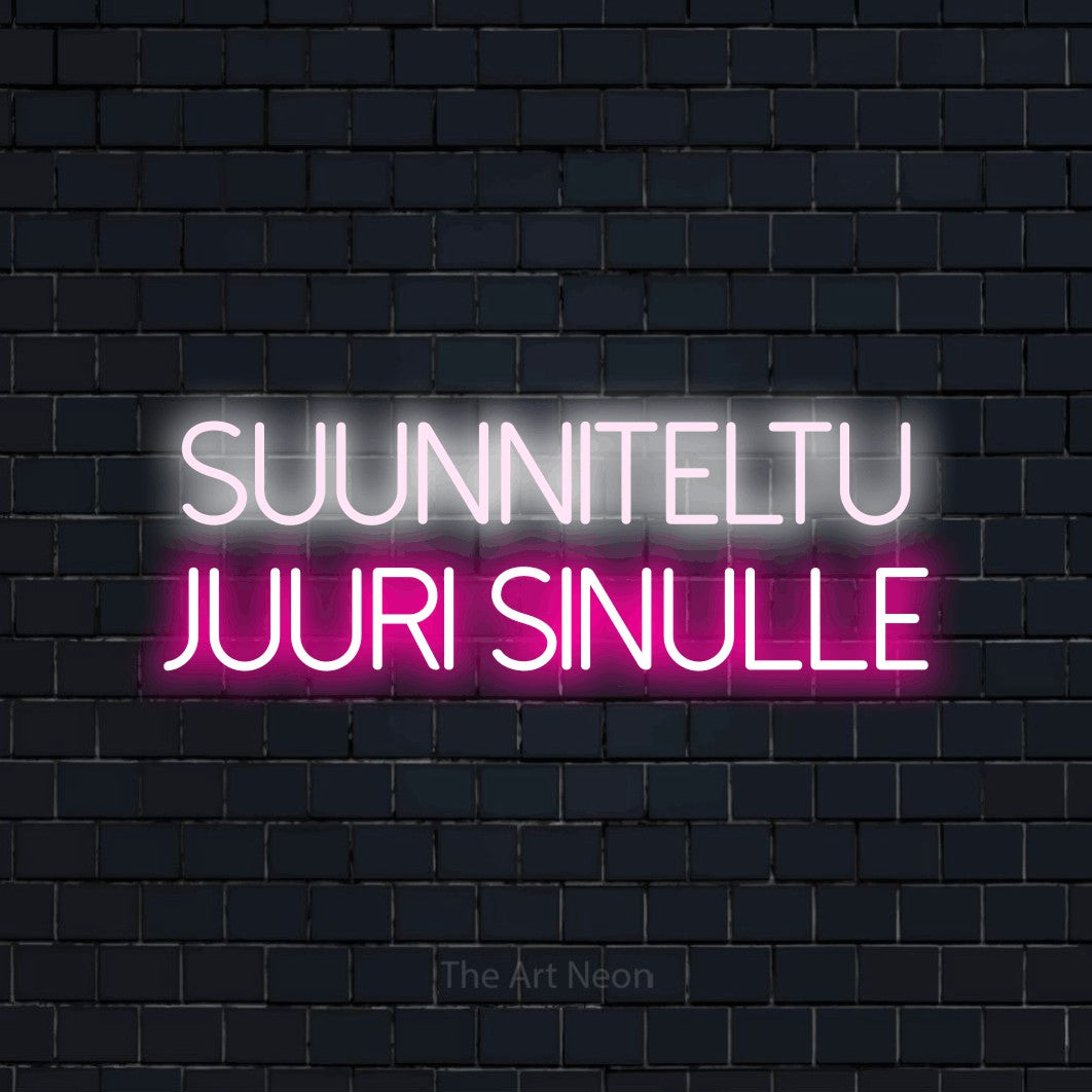 LED neon sign reading “Suunniteltu juuri sinulle”, arranged in 2 lines.