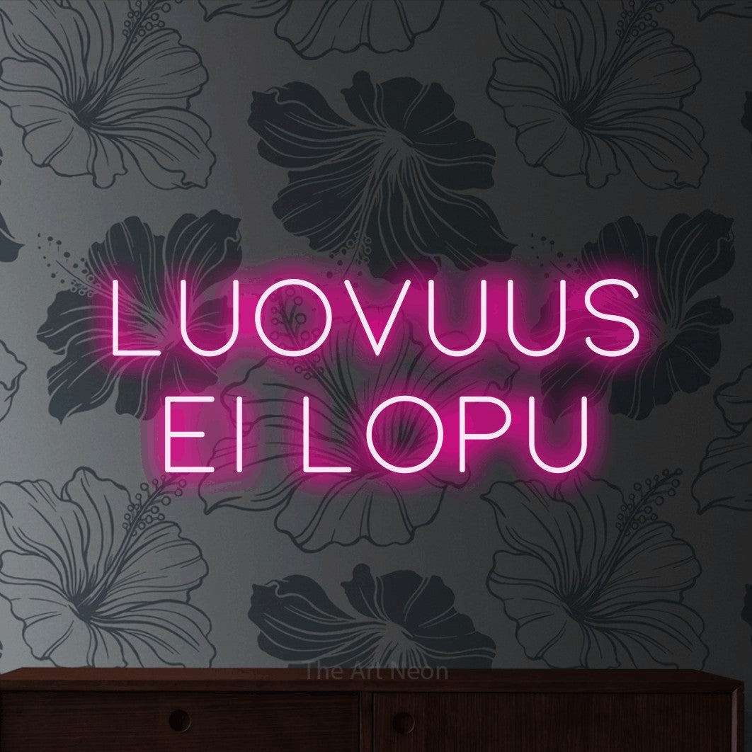 LED neon sign reading “Luovuus ei lopu”, arranged in 2 lines.