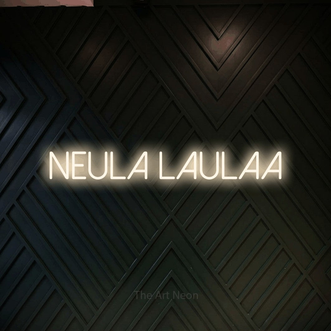 LED neon sign reading “Neula laulaa”, arranged in a single line.