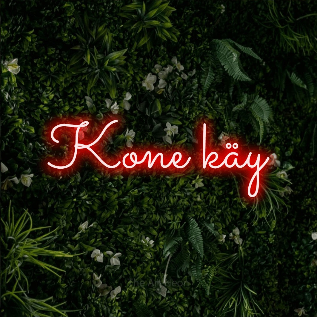 LED neon sign reading “Kone käy”, arranged in a single line.