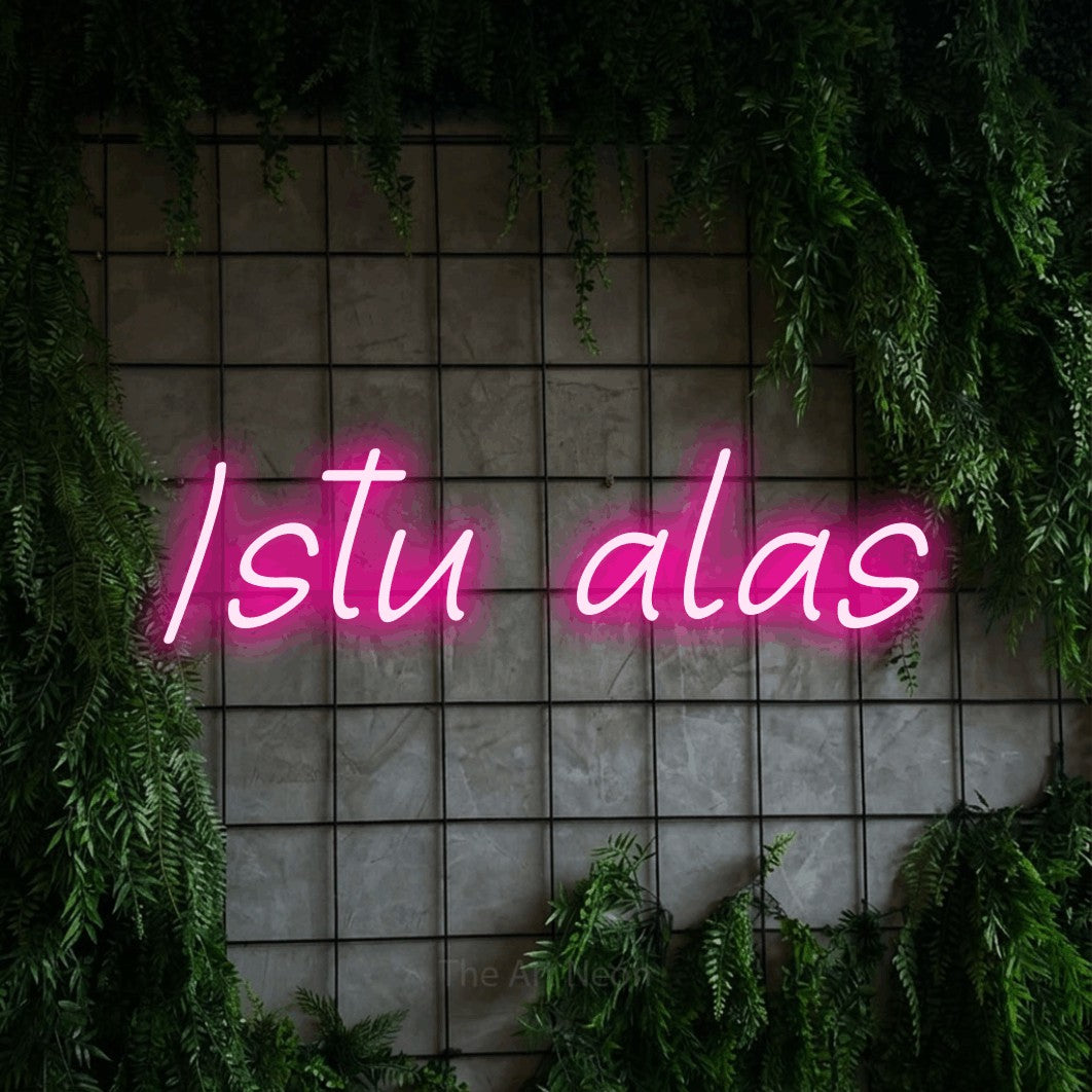 LED neon sign reading “Istu alas”, arranged in a single line.