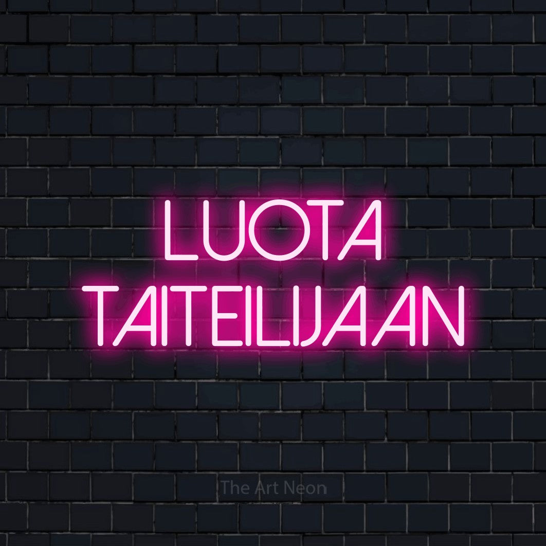 LED neon sign reading “Luota taiteilijaan”, arranged in 2 lines.
