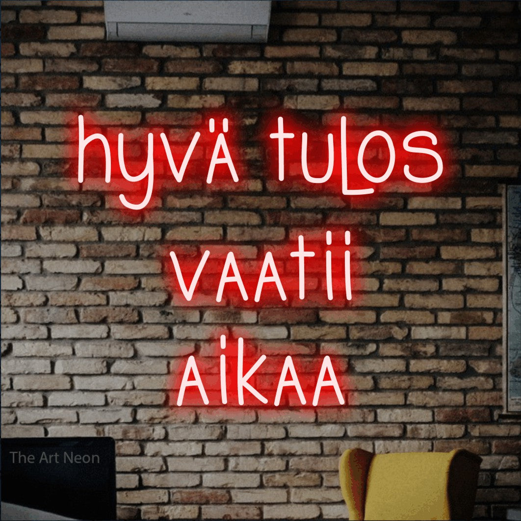 LED neon sign reading “hyvä tulos vaatii aikaa”, arranged in 3 lines.
