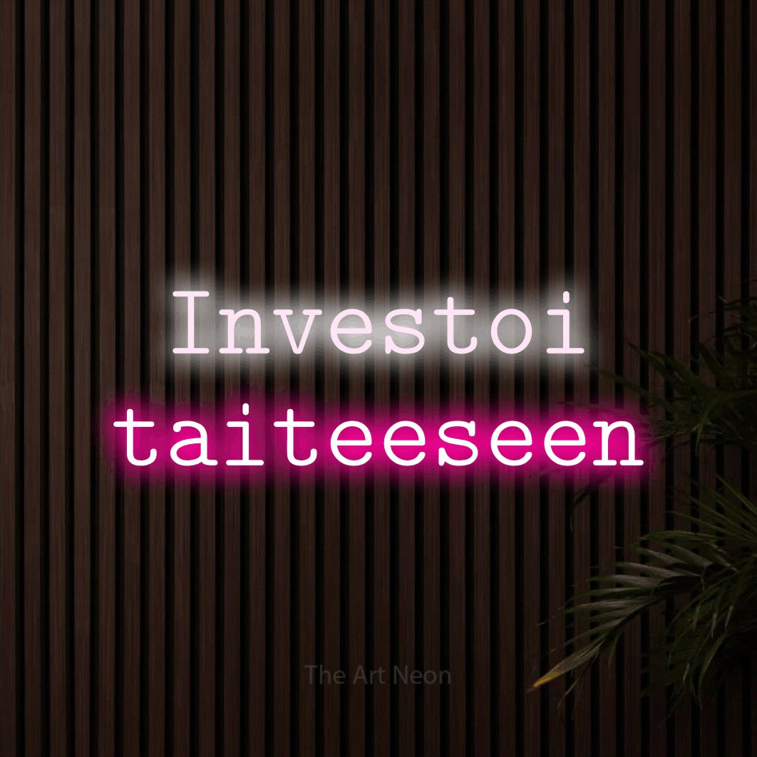 LED neon sign reading “Investoi taiteeseen”, arranged in 2 lines.