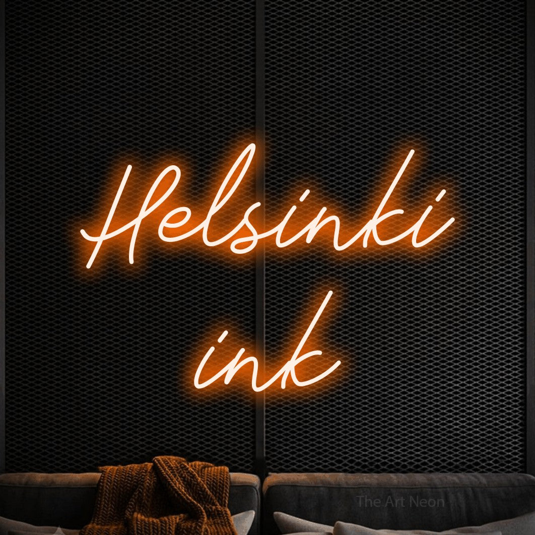 LED neon sign reading “Helsinki ink”, arranged in 2 lines.