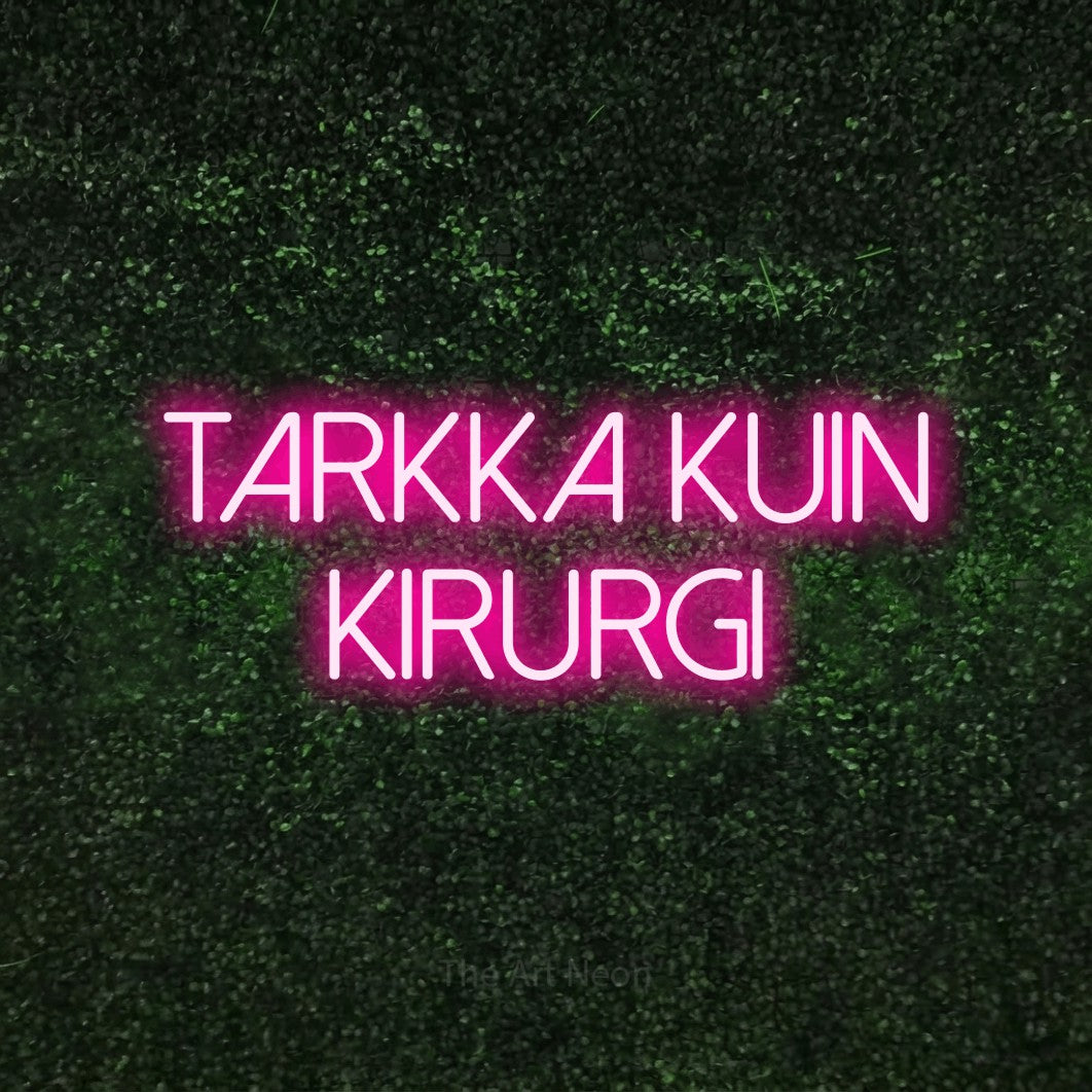 LED neon sign reading “Tarkka kuin kirurgi”, arranged in 2 lines.