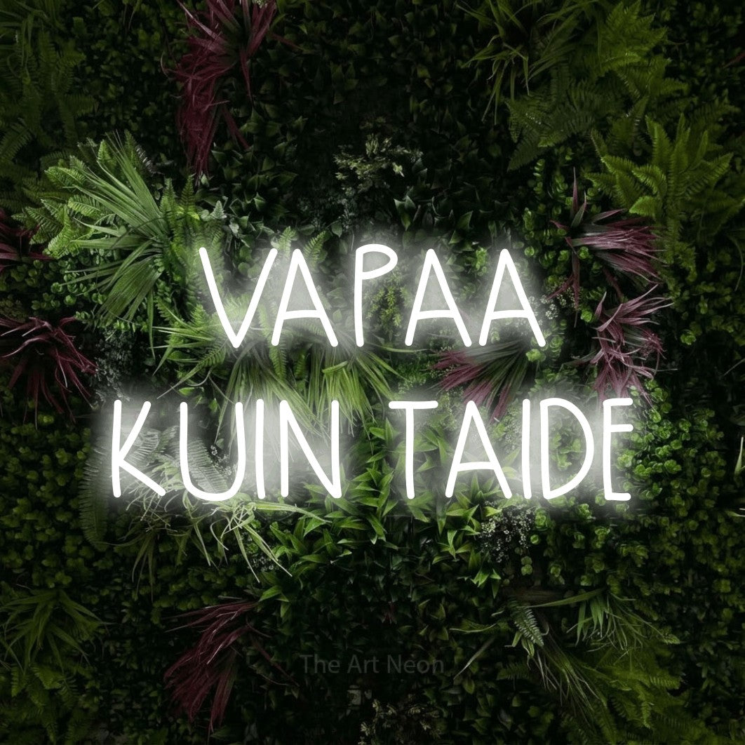 LED neon sign reading “VAPAA KUIN TAIDE”, arranged in 2 lines.