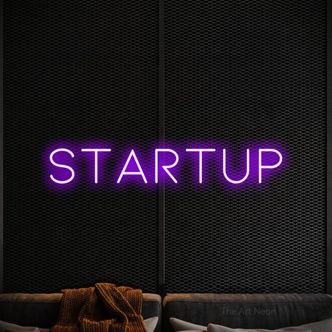 LED neon sign reading “Startup”, arranged in a single line.