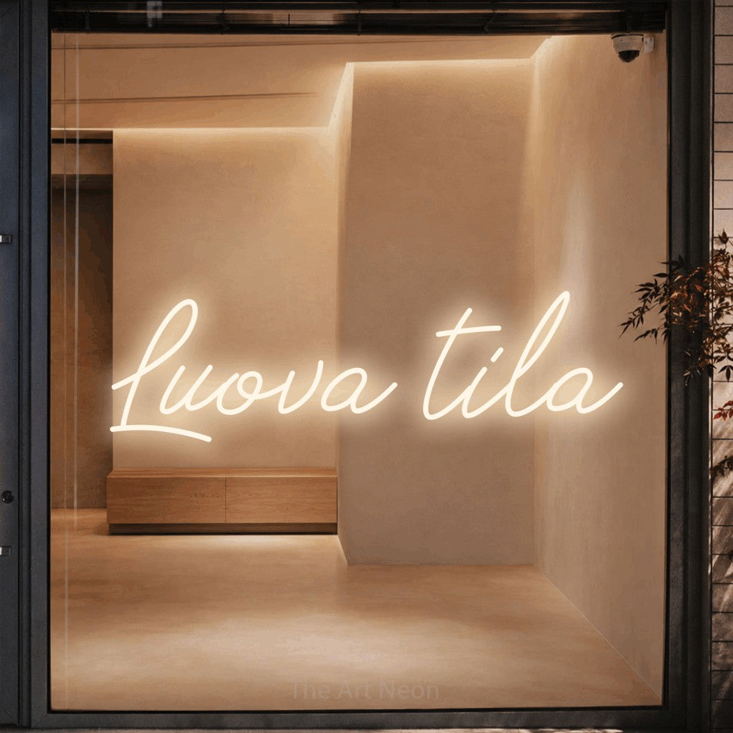 LED neon sign reading “Luova tila”, arranged in a single line.